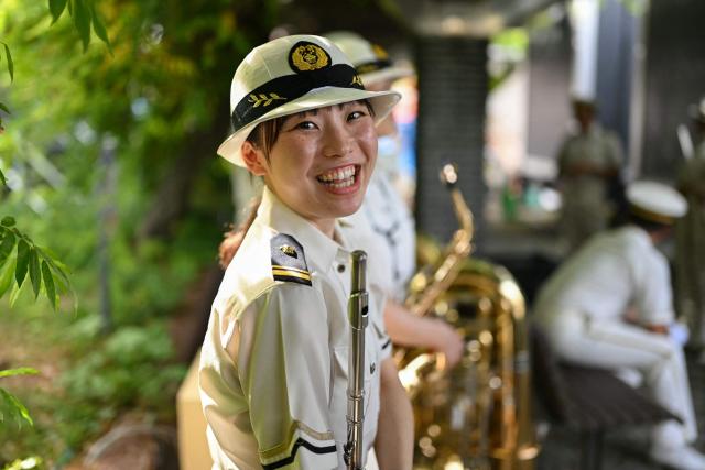 Members of a police band wait to perform to welcome teams at the 2026 Asian Games in Nagoya on September 18, 2026. (Photo by MOHD RASFAN / AFP)