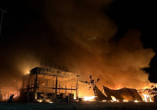This photograph shows a burning mall following a drone strike in Zaporizhzhia, late on September 17, 2026, amid the Russian invasion of Ukraine. (Photo by Darya NAZAROVA / AFP)
