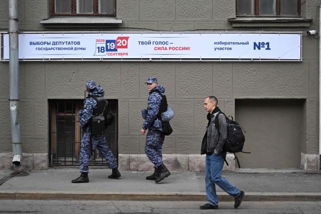 TOPSHOT - Russian National Guard (Rosgvardiya) officers patrol outside a polling station during Russia's parliamentary election in Moscow on September 18, 2026. (Photo by Igor IVANKO / AFP)