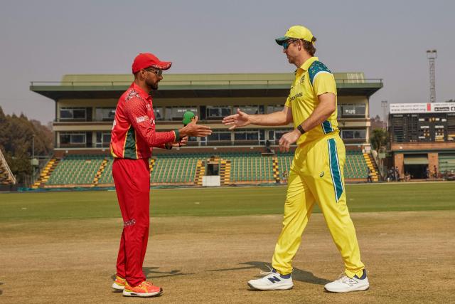 Zimbabwe's captain Sikandar Raza (L) shake hands with Australia's captain Mitchell Marsh (R) ahead of their second one-day international (ODI) cricket match between Zimbabwe and  Australia at the Harare Sports Club in Harare on September 18, 2026. (Photo by Jekesai NJIKIZANA / AFP)