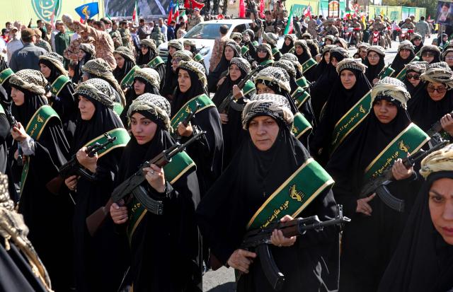 Members of Iran's Basij paramilitary force march with riffles during a military rally named Jan-Fada (those willing to sacrifice their lives) in Tehran September 18, 2026. (Photo by AFP) / Israel OUT / NO Access Israel Media/Persian Language TV Stations Outside Iran / Strictly No Access BBC Persian / VOA Persian/Manoto TV / Iran International
/ Radio Farda --
Attention editors: AFP covers the war in the Middle East through its extensive regional network, including bureaus in Tehran, Jerusalem, and several neighboring countries. Since the start of the conflict, journalists have been working under increasingly restrictive conditions. Authorities in several countries have limited reporters' movements, photo and live video coverage from sensitive locations. Some governments and armed groups have banned images of missile or drone strikes and other security-related sites. / 