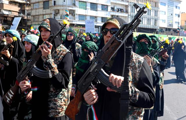 Members of Iran's Basij paramilitary force march with riffles during a military rally named Jan-Fada (those willing to sacrifice their lives) in Tehran September 18, 2026. (Photo by AFP) / Israel OUT / NO Access Israel Media/Persian Language TV Stations Outside Iran / Strictly No Access BBC Persian / VOA Persian/Manoto TV / Iran International
/ Radio Farda --
Attention editors: AFP covers the war in the Middle East through its extensive regional network, including bureaus in Tehran, Jerusalem, and several neighboring countries. Since the start of the conflict, journalists have been working under increasingly restrictive conditions. Authorities in several countries have limited reporters' movements, photo and live video coverage from sensitive locations. Some governments and armed groups have banned images of missile or drone strikes and other security-related sites. / 