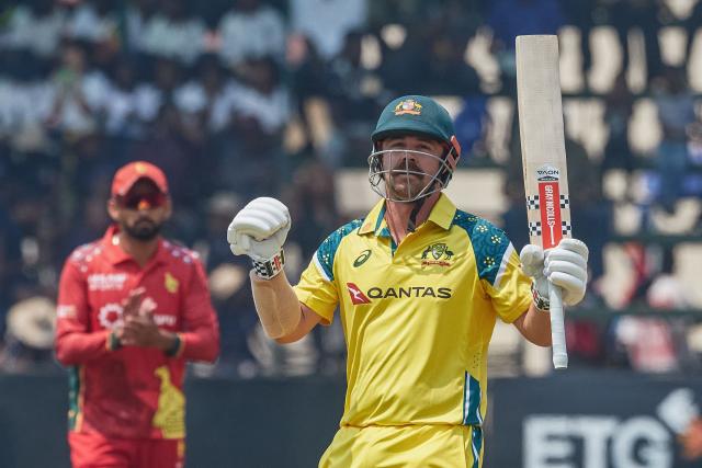 TOPSHOT - Australia's Travis Head celebrates after scoring a century (100 runs) during the second one-day international (ODI) cricket match between Zimbabwe and Australia at the Harare Sports Club in Harare on September 18, 2026. (Photo by Jekesai NJIKIZANA / AFP)