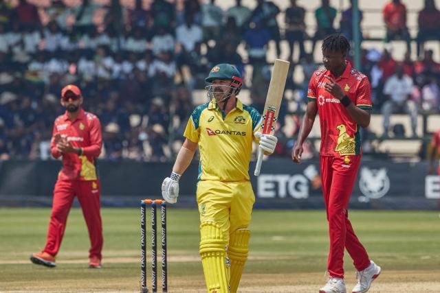 Australia's Travis Head celebrates after scoring a century (100 runs) during the second one-day international (ODI) cricket match between Zimbabwe and Australia at the Harare Sports Club in Harare on September 18, 2026. (Photo by Jekesai NJIKIZANA / AFP)