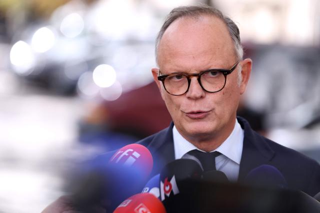 Right wing party Horizons' president Edouard Philippe speaks to press as he leaves after a meeting with France's President at the presidential Elysee Palace in Paris on September 18, 2026, to discuss international conflicts and their domestic implications. (Photo by Kenzo TRIBOUILLARD / AFP)