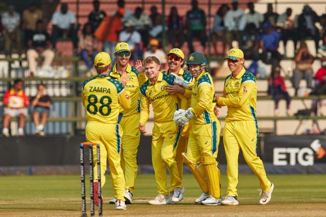 Australia's players celebrate a wicket during the second one-day international (ODI) cricket match between Zimbabwe and Australia at the Harare Sports Club in Harare on September 18, 2026. (Photo by Jekesai NJIKIZANA / AFP)