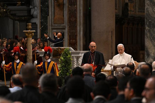 Pope Leo XIV (R) and Italian cardinal Baldassare Reina (C) attend a Diocesan assembly of Rome at the Basilica of Saint John Lateran, in central Rome, on September 18, 2026. (Photo by Andreas SOLARO / AFP)