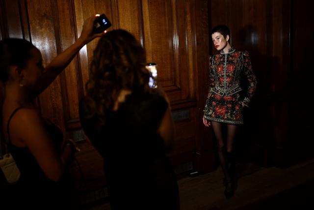 A model poses for pictures backstage before presenting creations from Annies’s during a catwalk show for their Spring/Summer 2027 collection on the second day of London Fashion Week, in London on September 18, 2026. (Photo by Henry NICHOLLS / AFP)