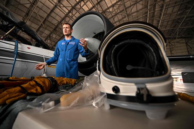 The US co-pilot of the NASA WB-57 high-altitude research aircraft, Cary Klemm, poses for a photograph inside a hangar at Teniente Octavio Rodriguez Garrido Air Base in Arraijan, Panama, on September 18, 2026. The NASA high-altitude research aircraft is operating in Panama from August 24 to September 23 as part of a NOAA mission conducted in collaboration with NASA to study the atmosphere and measure aerosols, atmospheric gases, ozone, water vapor and weather conditions. (Photo by MARTIN BERNETTI / AFP)