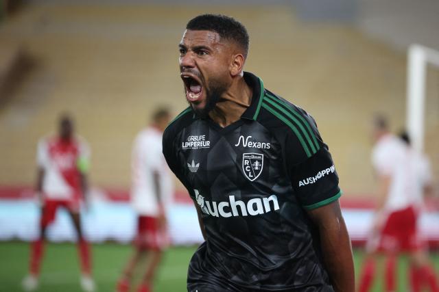 Lens' French defender #14 Matthieu Udol celebrates after scoring a goal during the French L1 football match between AS Monaco and RC Lens at the Stade Louis II in Monaco on September 18, 2026. (Photo by Valery HACHE / AFP)