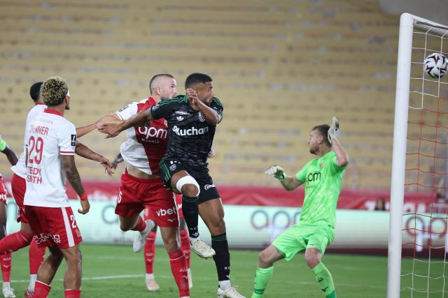 Lens' French defender #14 Matthieu Udol heads the ball to score a goal during the French L1 football match between AS Monaco and RC Lens at the Stade Louis II in Monaco on September 18, 2026. (Photo by Valery HACHE / AFP)