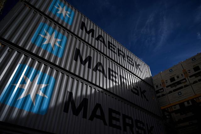 (FILES) This photograph shows the A.P. Moller-Maersk logo on containers piled on the worlds first methanol-enabled container vessel called "Laura Maersk" of A.P. Moller-Maersk, after its namegiving ceremony on September 14, 2023 in Copenhagen, Denmark. Danish global shipping giant Maersk said on September 18, 2026 it had ordered 26 large container vessels as part of an ongoing fleet renewal. The vessels are expected to be delivered in 2029 and 2030, the company told AFP in an email. (Photo by Sergei GAPON / AFP)