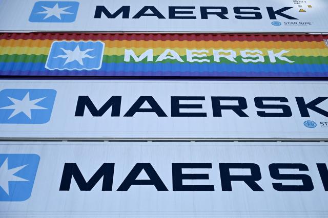 (FILES) Containers with the logos of A.P. Moller-Maersk, the world's second-largest container shipping firm, are stocked on the worlds first methanol-enabled container vessel, that is anchored pior to the namegiving ceremony in Copenhagen on September 14, 2023. Danish global shipping giant Maersk said on September 18, 2026 it had ordered 26 large container vessels as part of an ongoing fleet renewal. The vessels are expected to be delivered in 2029 and 2030, the company told AFP in an email. (Photo by Sergei GAPON / AFP)
