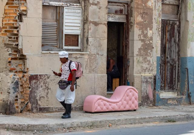A sofa is displayed for sale during a blackout in Havana on September 18, 2026. Cuba was plunged into its seventh massive blackout of the year on September 18, 2026, the energy ministry said, as fuel shortages bite on the US-blockaded island. (Photo by ADALBERTO ROQUE / AFP)