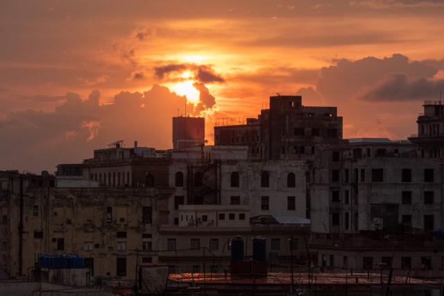 The sun sets during a power outage in Havana on September 18, 2026. Cuba was plunged into its seventh massive blackout of the year on September 18, 2026, the energy ministry said, as fuel shortages bite on the US-blockaded island. (Photo by ADALBERTO ROQUE / AFP)