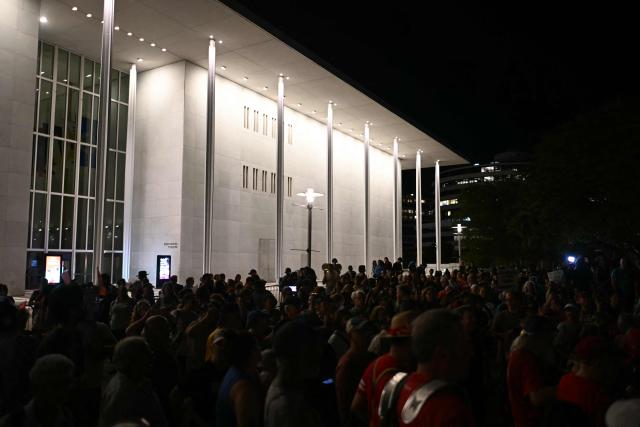 People gather during a rally in support of the Kennedy Center in Washington, DC, on September 18, 2026. (Photo by Kent NISHIMURA / AFP)