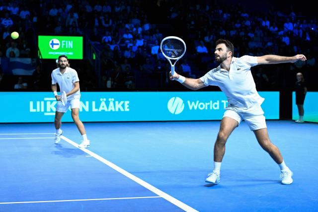 Monaco's Romain Arneodo and Monaco's Hugo Nys (L) play during the Davis Cup World Group I men's doubles tennis match between Finland and Monaco in Espoo, Finland, on September 19, 2026. Monaco won the doubles match and leads the event before the singles matches. (Photo by Heikki Saukkomaa / Lehtikuva / AFP) / Finland OUT