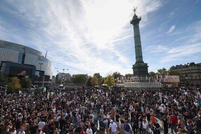 Participants gather at Place de la Bastille as they take part in the Techno Parade 2026 in Paris on September 19, 2026. (Photo by Charlotte SIEMON / AFP)