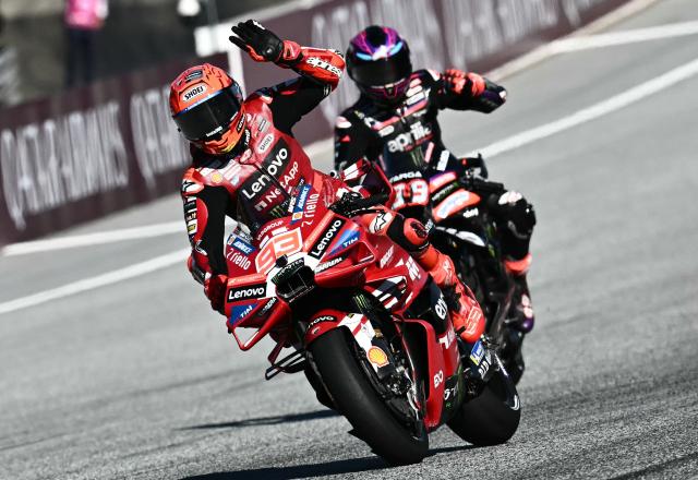 Ducati Lenovo Team's Spanish driver Marc Marquez (L) and Aprilia Racing's Spanish driver Jorge Martin react after competing in the Sprint event of the Grand Prix of Austria MotoGP in Spielberg bei Knittelfeld, Austria, on September 19, 2026. (Photo by Joe Klamar / AFP)