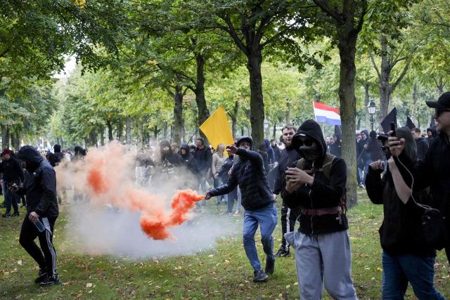 Demonstrators take part in a far-right rally under the banner 'We Are The People' at the Malieveld in The Hague on September 19, 2026. Dutch riot police clashed on September 19, 2026, with around 500 far-right protesters, who pelted them with fireworks and other projectiles after chanting anti-Semitic slogans at a rally in the centre of The Hague. (Photo by Lina Selg / ANP / AFP) / Netherlands OUT