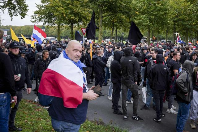 Demonstrators take part in a far-right rally under the banner 'We Are The People' at the Malieveld in The Hague on September 19, 2026. Dutch riot police clashed on September 19, 2026, with around 500 far-right protesters, who pelted them with fireworks and other projectiles after chanting anti-Semitic slogans at a rally in the centre of The Hague. (Photo by Lina Selg / ANP / AFP) / Netherlands OUT