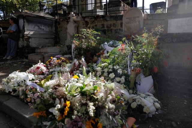This photograph shows flowers at the grave of late French singer Catherine Ringer, near her late partner Fred Chichin, at the end of her funeral at Montmartre cemetery in Paris on September 19, 2026. Catherine Ringer, singer of the iconic French pop-rock duo Les Rita Mitsouko, has died of cancer on September 14, 2026, at the age of 68. (Photo by GEOFFROY VAN DER HASSELT / AFP)
