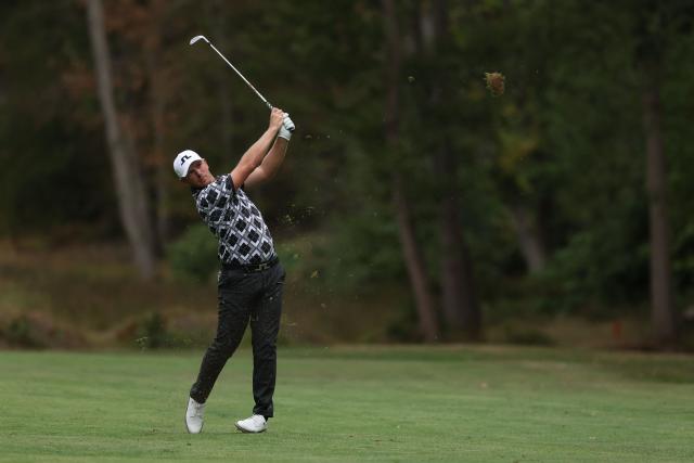 England's Matt Wallace watches his approach shot from the 16th fairway on day three of the BMW PGA Championship at Wentworth Golf Club in the town of Virginia Water in Surrey, southwest of London, on September 19, 2026. (Photo by Adrian DENNIS / AFP)