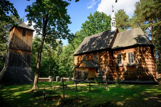 This photograph taken on September 19,2026 shows a wooden church in the reconstructed village featured at the open air Countryside Museum outside the town of Radom, 100 km south of Warsaw. (Photo by Mladen ANTONOV / AFP)