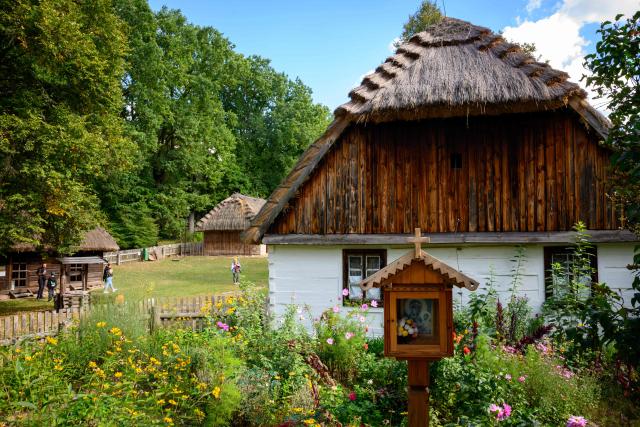 People visit the reconstructed village featured at the open air Countryside Museum outside the town of Radom, 100 km south of Warsaw on September 19,2026. (Photo by Mladen ANTONOV / AFP)