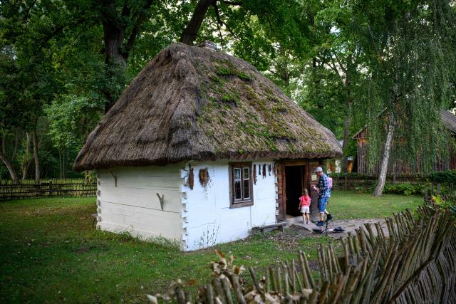 People visit the reconstructed village featured at the open air Countryside Museum outside the town of Radom, 100 km south of Warsaw on September 19,2026. (Photo by Mladen ANTONOV / AFP)