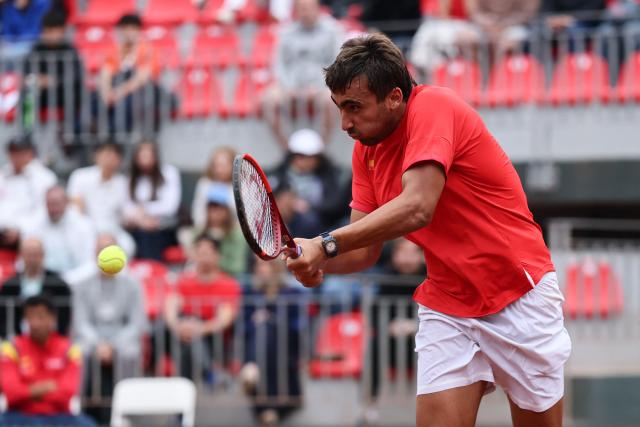 Spain's Daniel Merida returns the ball to Chile's Alejandro Tabilo during their Davis Cup Qualifiers second-round tennis match at the Parque Deportivo Estadio Nacional in Santiago on September 19, 2026. (Photo by Javier TORRES / AFP)