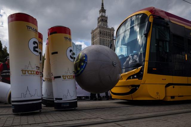 The tram of the Bulgaria's team from Sofia competes during the 12th European Tram Driver Championship in front of Palace of Culture and Science on Marszalkowska street in Warsaw's downtown, on September 19, 2026. 26 teams – each consisting of a female and a male tram driver, from 25 cities and 24 European countries, plus one guest team from Melbourne, Australia – show off their driving skills in a series of challenging competitions that test their precision, concentration, feel for the vehicle, and control of the tram. (Photo by Wojtek RADWANSKI / AFP)