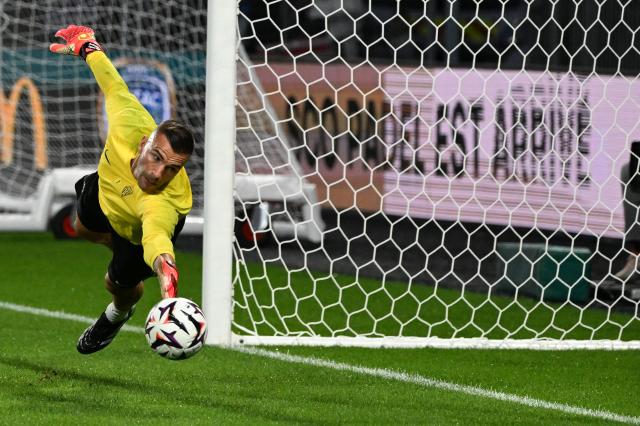 Angers' Portuguese goalkeeper #1 Anthony Lopes warms up prior to the French L1 football match between Olympique Lyonnais (OL) and Stade Rennais FC (Rennes) at the Parc OL stadium in Decines-Charpieu, central-eastern France, on September 19, 2026. (Photo by Sebastien Salom-Gomis / AFP)