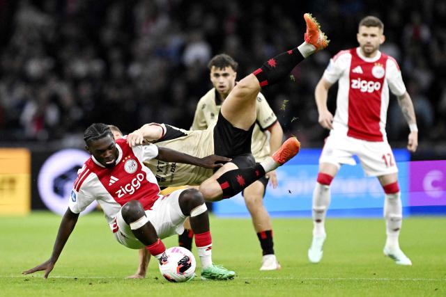 Ajax's Belgian midfielder #24 Jorthy Mokio (L) fights for the ball with Excelsior's Dutch defender #03 Rick Meissen (R) during the Dutch Eredivisie football match between Ajax Amsterdam and SBV Excelsior at the Johan Cruijff ArenA in Amsterdam on September 19, 2026. (Photo by Olaf Kraak / ANP / AFP) / Netherlands OUT