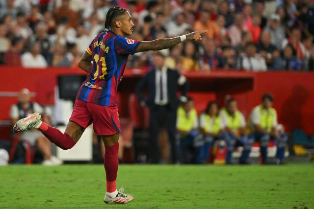 Barcelona's Brazilian forward #11 Raphinha celebrates after scoring a goal during the Spanish league football match between Sevilla FC and FC Barcelona at the Ramon Sanchez Pizjuan stadium in Seville on September 19, 2026. (Photo by JORGE GUERRERO / AFP)