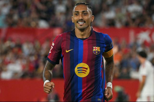 Barcelona's Brazilian forward #11 Raphinha celebrates scoring his team's second goal during the Spanish league football match between Sevilla FC and FC Barcelona at the Ramon Sanchez Pizjuan stadium in Seville on September 19, 2026. (Photo by JORGE GUERRERO / AFP)