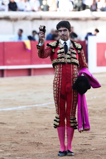 French matador Sebastien Castella salutes with an ear as his trophy after a bullfight as part of the Feria in Nîmes, southern France, on September 19, 2026. (Photo by Thibaud MORITZ / AFP)