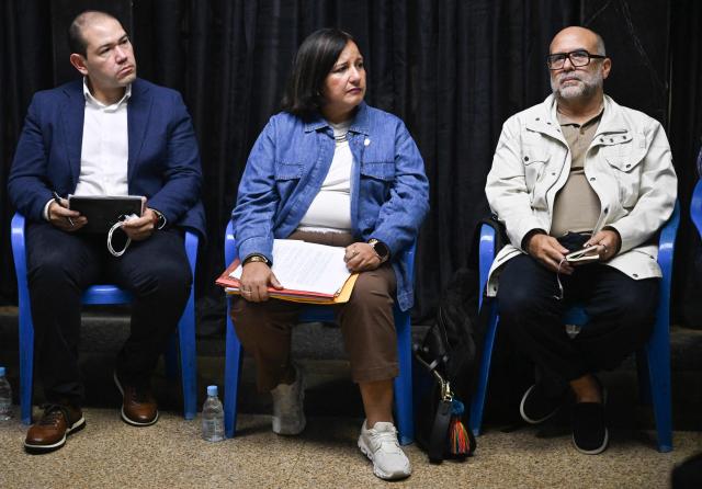 The head of Venezuela's opposition delegation, Dinorah Figuera (C), and other delegation members meet with relatives of political prisoners in Caracas on September 19, 2026. (Photo by Juan BARRETO / AFP)