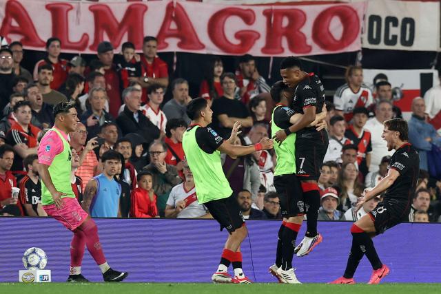 Huracan's Colombian forward #07 Oscar Cortes (2nd R) celebrates with teammates after scoring a goal during the Argentine Professional League 2026 Clausura tournament football match between River Plate and Huracan at the Mas Monumental stadium in Buenos Aires on September 19, 2026. (Photo by Alejandro PAGNI / AFP)
