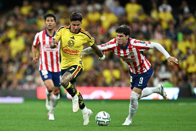 America's Uruguayan midfielder #07 Brian Rodriguez and Guadalajara's defender #03 Diego Campillo fight for the ball during the Liga MX Apertura tournament football match between America and Guadalajara at Banorte stadium in Mexico City on September 19, 2026. (Photo by YURI CORTEZ / AFP)