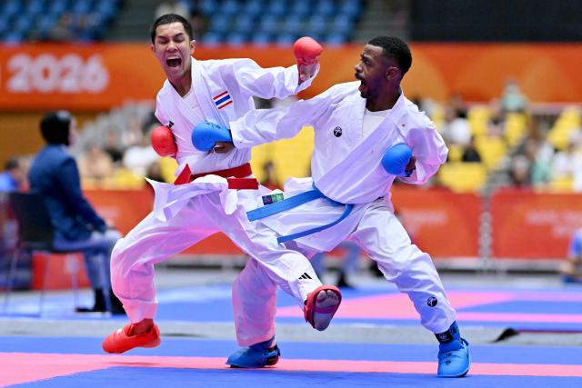 Thailand's Siwakon Muekthong and Saudi Arabia's Saud Abdulaziz Albasher compete in the men's kumite -60kg karate bout during the 2026 Asian Games at the Toyohashi Gymnasium in Toyohashi, Aichi prefecture on September 20, 2026. (Photo by MOHD RASFAN / AFP)