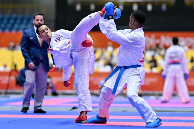 Thailand's Siwakon Muekthong (L) and Saudi Arabia's Saud Abdulaziz Albasher compete in the men's kumite -60kg karate bout during the 2026 Asian Games at the Toyohashi Gymnasium in Toyohashi, Aichi prefecture on September 20, 2026. (Photo by MOHD RASFAN / AFP)