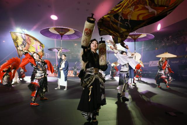 Dancers perform before the start of the women's final teqball match at the 2026 Asian Games in Nagoya on September 20, 2026. (Photo by DAVID GRAY / AFP)