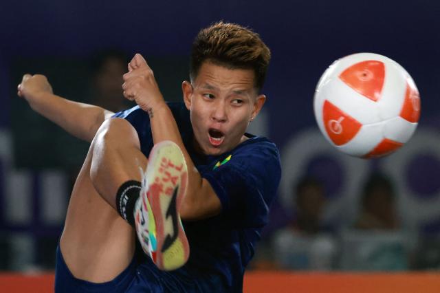 Myanmar's Wai Khin Hnin plays a point against Indonesia's Sumaya during their women's final teqball match at the 2026 Asian Games in Nagoya on September 20, 2026. (Photo by DAVID GRAY / AFP)