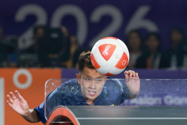 Myanmar's Wai Khin Hnin plays a point against Indonesia's Sumaya during their women's singles final teqball match at the 2026 Asian Games in Nagoya on September 20, 2026. (Photo by DAVID GRAY / AFP)