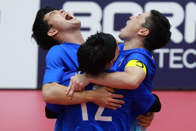 Japan's players celebrate their victory during the men's team regu sepak takraw match between India and Japan at Nagoya City Mizuho Park Gymnasium in Nagoya on September 21, 2026. (Photo by DAVID GRAY / AFP)