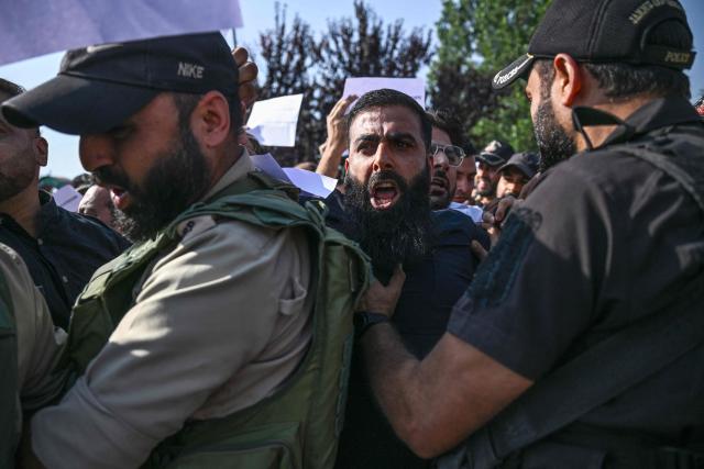 Supporters of the Jammu and Kashmir Apni Party (JKAP) clash with police personnel during a protest against the government demanding employment for youth and basic amenities in Srinagar on September 21, 2026. (Photo by Tauseef MUSTAFA / AFP)