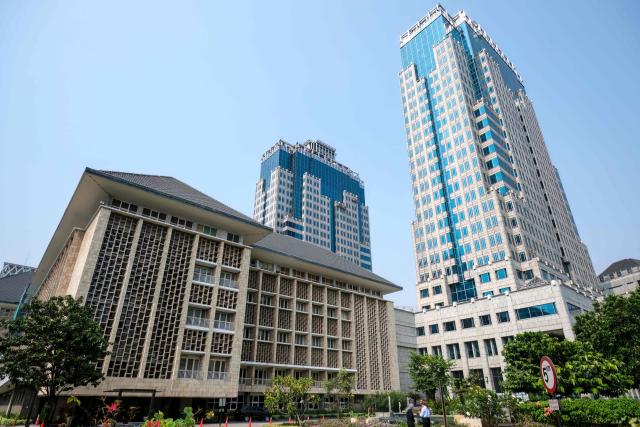 A general view shows the heritage building alongside high-rise towers within the Bank Indonesia (Indonesia's Central Bank) headquarters complex in Jakarta on September 21, 2026. (Photo by BAY ISMOYO / AFP)