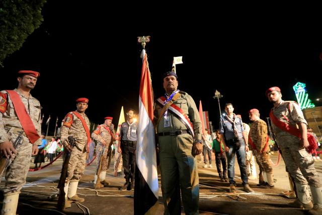 Security personnel stand guard during a ceremony organised by Houthi authorities to mark the 12th anniversary of takeover of Yemeni capital, in Sanaa on September 20, 2026. (Photo by Mohammed HUWAIS / AFP)