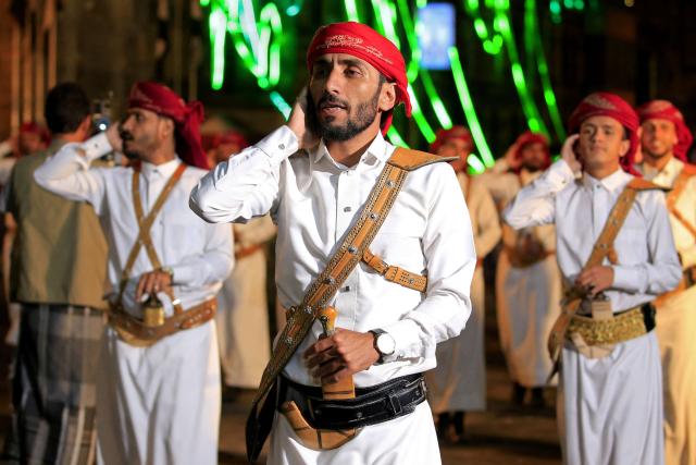 Band members of the Houthi authorities, perform during a ceremony to mark the 12th anniversary of takeover of Yemeni capital, in Sanaa on September 20, 2026. (Photo by Mohammed HUWAIS / AFP)
